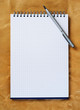 Note pad with pen.