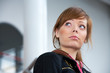 Teenage girl in modern building, serious