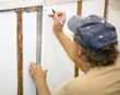 Contractor installing insulation