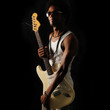 young trendy african man holding electric guitar - isolated