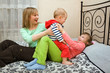 indoor portrait of a family: mother with her children