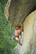 A rock climber makes his way up a crack on Suicide Rock.