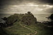 A view of Dunnottar Castle under a cloudy sky, Scotland A view of Dunnottar Castle under a cloudy sky, Scotland