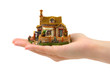 Hand and house isolated on white background