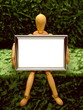 Manikin Holding Blank Frame