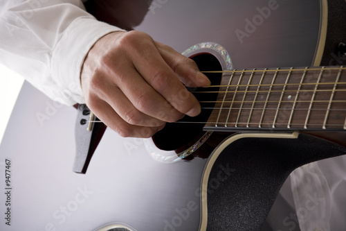 Photo: High key acoustic guitarist with copy space High key acoustic guitarist with copy space