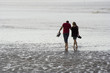 Couple walk on the beach