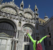 Beautiful tourist in front of San Marco cathedral
