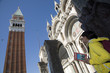 Tourist consulting a guide in Piazza San Marco, Venezia