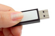 Flash drive in hand isolated on white background Flash drive in hand isolated on white background