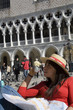 Tourist having a break in front of the Palazzo Ducale, Venezia