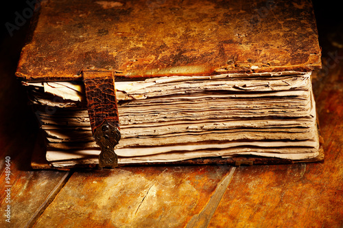 Photo: Old shabby book in leather cover Old shabby book in leather cover
