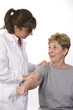 physical therapist talks to a patient