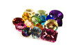 A grouping of large carat-weight gemstones on white.