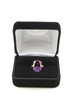 A large corundum ring in a box on a white background