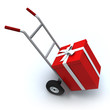 Big red gift box in a push cart Big red gift box in a push cart