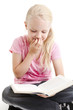 Young girl reading funny book over white background