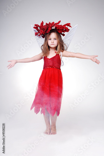 Photo: Gorgeous little girl in red Halloween dress. Gorgeous little girl in red Halloween dress.