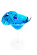 Blue cocktail in martini glass isolated over white background