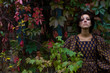 Portrait of beautiful girl in the autumn garden