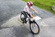 bicycling through puddle