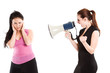 An angry businesswoman shouting toward her colleague