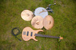 musical instruments, guitar, drum, plates on grass. musical instruments, guitar, drum, plates on grass.
