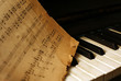 The keyboard of the piano and old notes