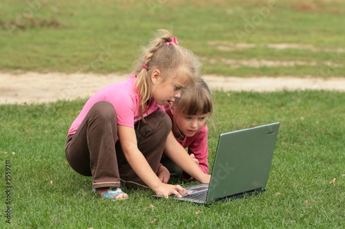 Photo: two girls with laptop two girls with laptop