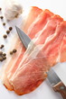 Ham, pepper, knife and garlic