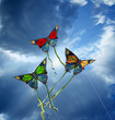 Photo: Three colorful kites at cloudy sky Three colorful kites at cloudy sky
