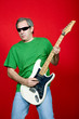 mature casual man plauing guitar on a red background mature casual man plauing guitar on a red background