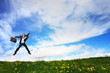 Jumping business man on Green Field