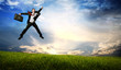 Jumping business man on Green Field