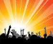 People at the concert with hands in the backlight