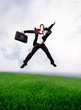 Jumping business man on Green Field
