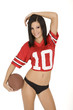 Beautiful and sexy Caucasian female posing with a football
