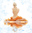 beautiful lady with orange towels on white sand