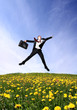 Jumping business man on Green Field