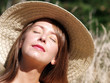 woman wearing a hat enjoying the sun