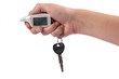 Hand and car key isolated on white background
