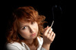 young smoking girl isolated on the black