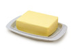 Butter on grey butterdish isolated on white background