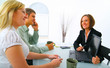 businesswoman showing laptop to professional couple