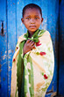 african boy living in a very poor community