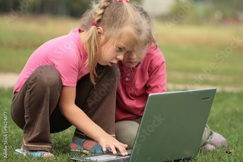 Photo: two little girls at laptop two little girls at laptop