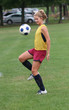 Youth Teen Soccer Player Bouncing Ball in Air Youth Teen Soccer Player Bouncing Ball in Air
