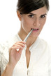 lady with pen in her mouth on an isolated white background