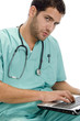 doctor with laptop and stethoscope on an isolated background