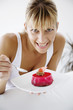 Foto: young female with a delicious cherry cake young female with a delicious cherry cake